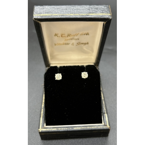 44 - A pair of diamond stud earrings mounted in 18ct white gold with 18ct yellow gold posts and butterfly... 