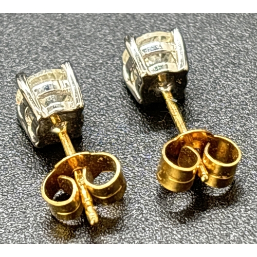 44 - A pair of diamond stud earrings mounted in 18ct white gold with 18ct yellow gold posts and butterfly... 