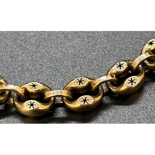 46 - A Victorian yellow gold oval link bracelet with pierced work star decoration and Albert clasp. No go... 