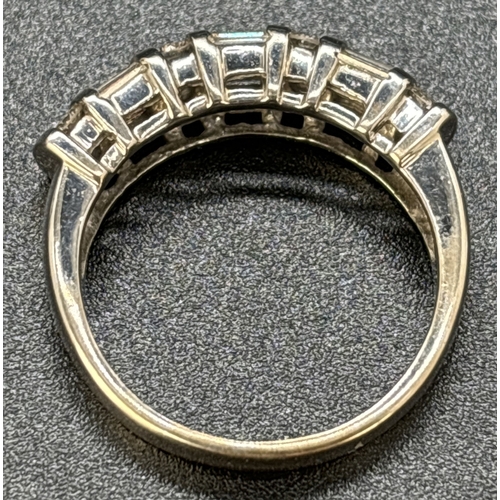 48 - A baguette and round cut diamond half eternity ring set in 18ct white gold. Alternating rows of 4 ba... 