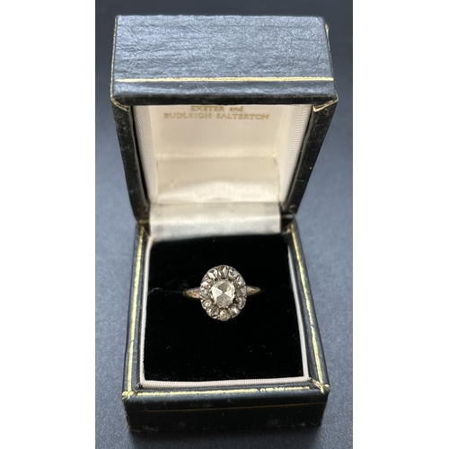 49 - A Victorian 18ct gold rose cut diamond cluster ring in a cut down setting. A central stone surrounde... 