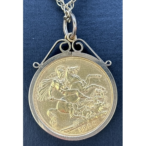 66 - A 1958 Elizabeth II sovereign coin in a 9ct gold pendant mount, on a 9ct gold 20