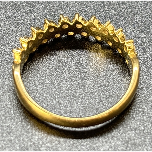 72 - An 18ct yellow gold half eternity ring with 2 offset rows of small brilliant cut diamonds with a tot... 