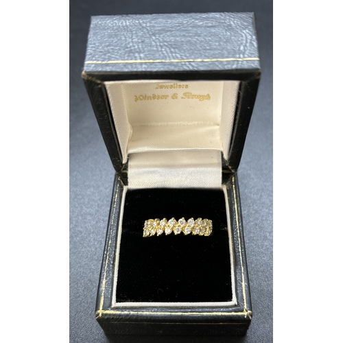 72 - An 18ct yellow gold half eternity ring with 2 offset rows of small brilliant cut diamonds with a tot... 