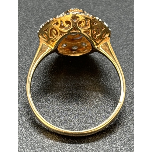 81 - A 9ct yellow gold marquise shaped diamond ring comprising a central raised panel set with 9 x 0.04ct... 