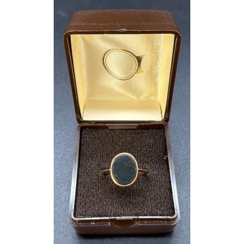 82 - A vintage 18ct gold oval cut bloodstone signet ring with floral engraved detail to front and back ed... 