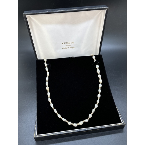 87 - A vintage 28 inch alternating freshwater keshi pearl and 9ct gold round bead necklace. With 9ct gold... 