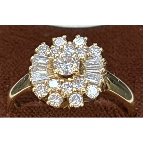 94 - An 18ct yellow gold, diamond cluster ring comprising 15 brilliant cut diamonds and 6 baguette cut di... 