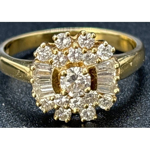 94 - An 18ct yellow gold, diamond cluster ring comprising 15 brilliant cut diamonds and 6 baguette cut di... 