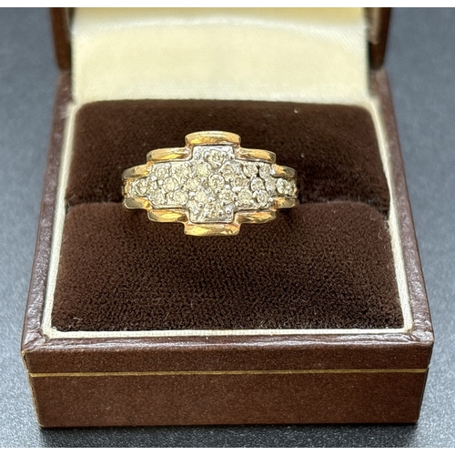 96 - A vintage 9ct gold 0.50ct diamond cluster ring in a flat stepped design with yellow gold surround an... 