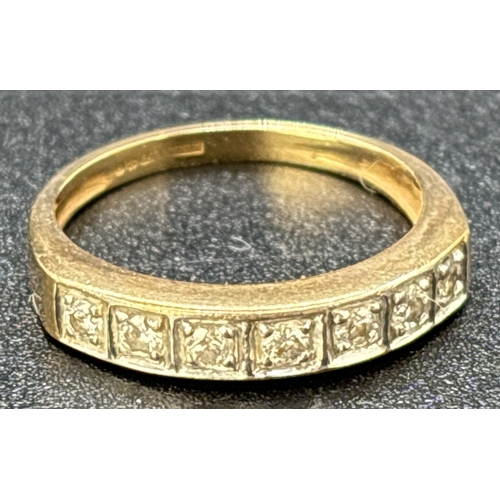 109 - A 9ct gold diamond set half eternity ring, square illusion setting with 7 round cut diamonds. Hallma... 