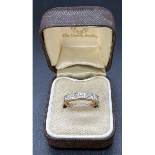 109 - A 9ct gold diamond set half eternity ring, square illusion setting with 7 round cut diamonds. Hallma... 