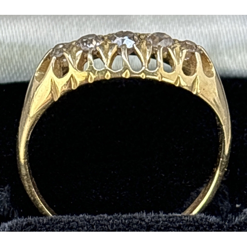 113 - A vintage Edwardian 9ct gold 5 diamond ring in pierced work claw setting. Very worn gold mark to ins... 