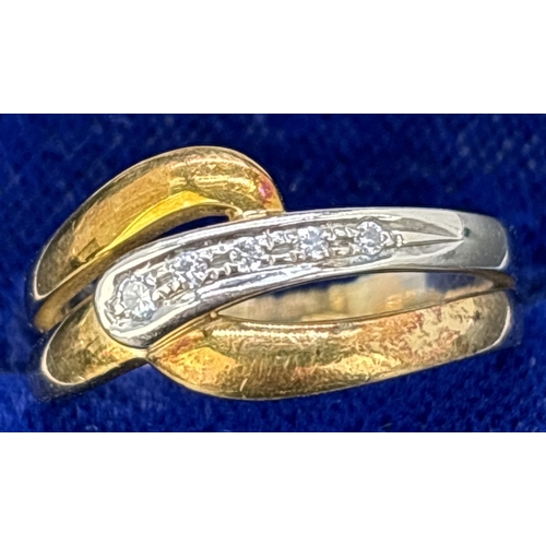 122 - An 18ct yellow and white gold crossover band style ring with 5 small illusion set diamonds. Full hal... 