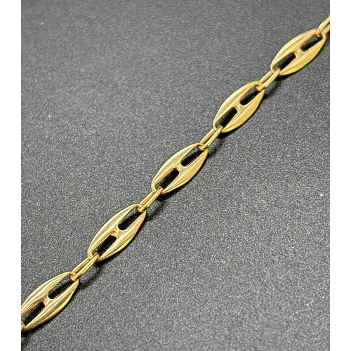 20 - An 18ct gold 7 inch mariners link chain bracelet with sliding clasp. Gold marks to clasp. Total weig... 