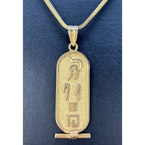 105 - An 18ct Egyptian gold hieroglyph pendant with Scarab beetle to ba Yck, o n a 24