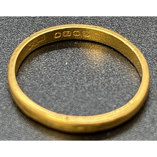 83 - A vintage 22ct gold 2mm thick band ring. Fully hallmarked inside band. Size M. Weight approx. 2.2g.