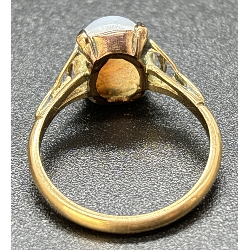 34 - A vintage 9ct gold opal cabochon dress ring. Scallop detail to shoulder with plain shank. Gold mark ... 