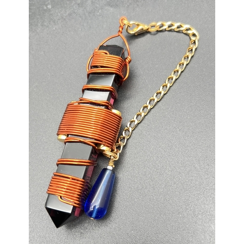 1372 - A Siberian violet quartz Etheric Weaver Healing Pendulum with wrapped copper wire, gold tone hanging... 