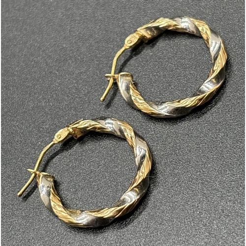 1041 - 2 pairs of 9ct gold hoop style earrings. A pair of duo coloured gold twist design hoops together wit... 