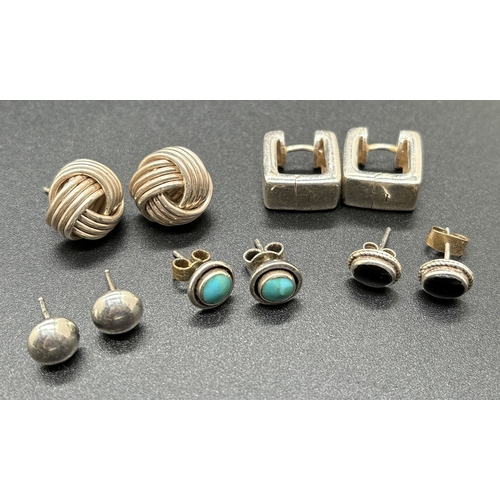 1069 - 5 pairs of silver and white metal earrings in stud and square hoop styles. To include large knot ear... 