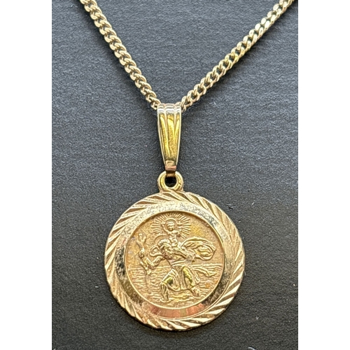 1073 - A small 9ct gold circular St. Christopher pendant on a 16 inch curb chain with spring ring clasp. Go... 