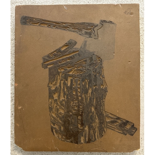 1380 - A vintage printing block stamp featuring a log and axe. Approx. 30 x 25cm.