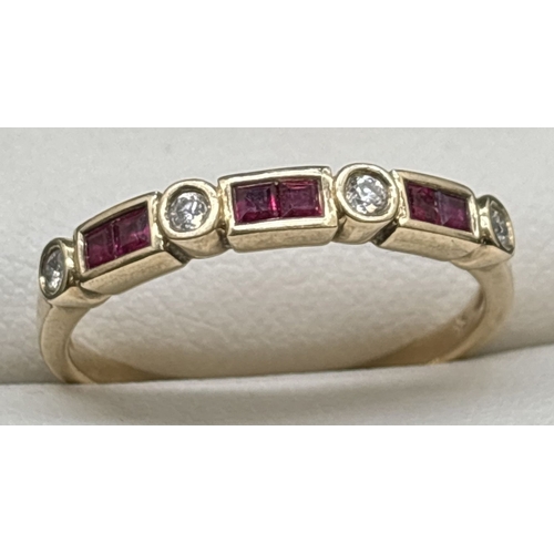 1089 - A 9ct gold ruby and diamond half eternity style ring. Bezel set with 6 square cut rubies and 4 round... 