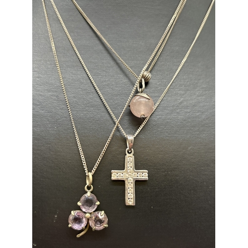 1091 - 3 silver necklaces with stone set pendants. A clover leaf pendant set with amethyst stones, a silver... 