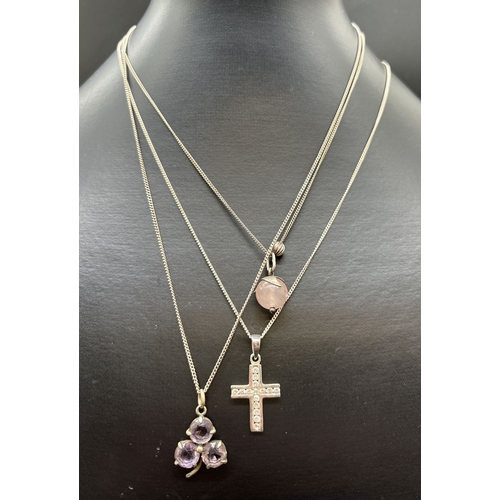 1091 - 3 silver necklaces with stone set pendants. A clover leaf pendant set with amethyst stones, a silver... 