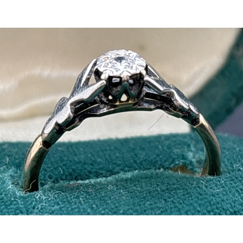 1101 - A 9ct gold diamond solitaire ring with platinum mount and shoulders. Hallmarked inside band. Ring si... 