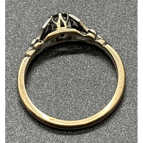 1101 - A 9ct gold diamond solitaire ring with platinum mount and shoulders. Hallmarked inside band. Ring si... 