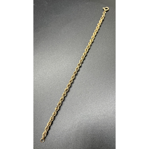 1106 - A 9ct gold 8 inch rope chain bracelet with spring ring clasp. Gold marks to fixings. Weight approx. ... 