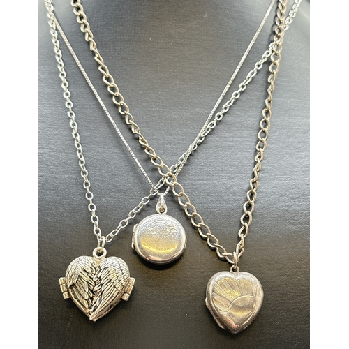 1108 - 3 silver lockets on silver chains. A vintage circular locket with front floral engraving, on 16