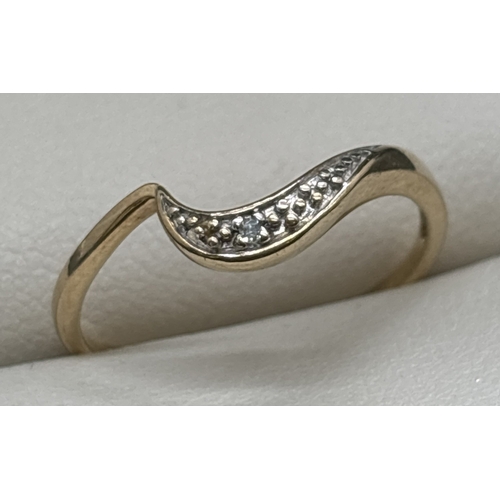 1112 - A 9ct gold wave band ring set with single illusion set diamond. Fully hallmarked inside band. Ring s... 