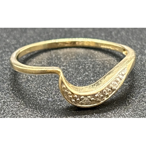 1112 - A 9ct gold wave band ring set with single illusion set diamond. Fully hallmarked inside band. Ring s... 