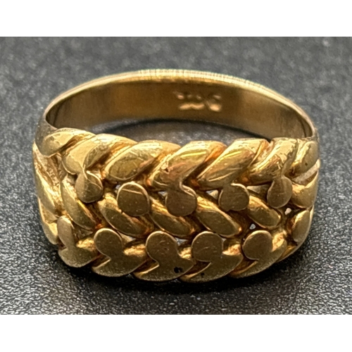 1113 - A 9ct gold 3 row Keeper ring. Gold mark inside band. Size N½. Total weight approx. 6.5g.