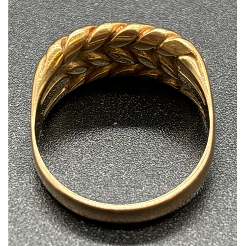 1113 - A 9ct gold 3 row Keeper ring. Gold mark inside band. Size N½. Total weight approx. 6.5g.