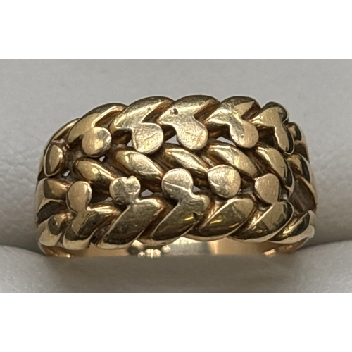 1113 - A 9ct gold 3 row Keeper ring. Gold mark inside band. Size N½. Total weight approx. 6.5g.