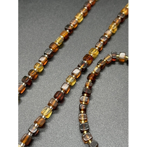 1115 - A cognac and honey amber beaded necklace  and matching bracelet. 24 inch small square amber beaded n... 