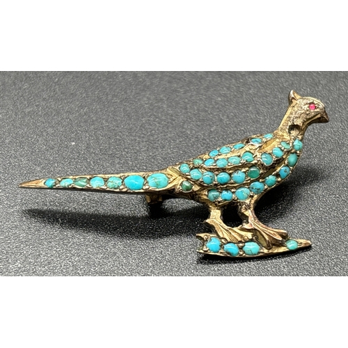 1119 - An antique gold brooch modelled as a pheasant with pave set turquoise cabochons (1 missing) and smal... 