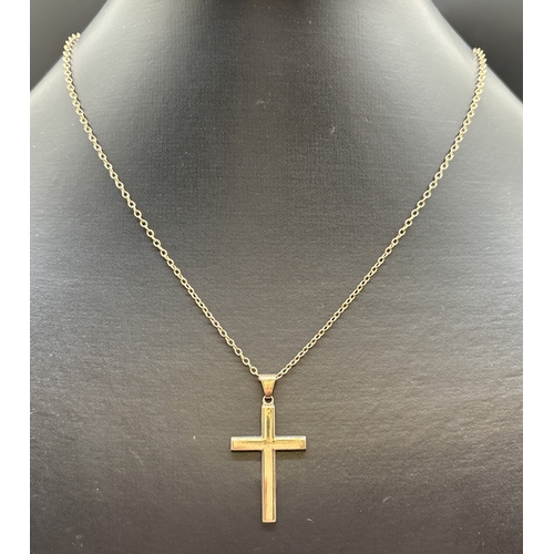 1130 - A 9ct gold plain cross pendant on a 16 inch belcher chain with spring ring clasp. Gold marks to pend... 