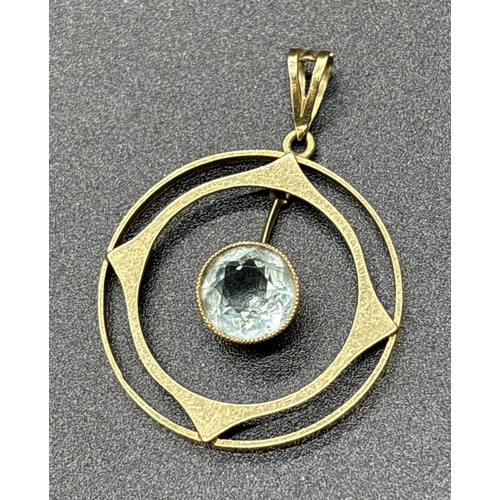 1136 - A 9ct gold Art Nouveau circular shaped pendant with suspended milgrain set round cut aquamarine. Gol... 