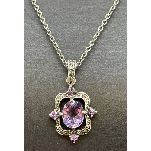 1137 - A silver Victorian inspired drop pendant necklace. Pendant set with a central oval cut amethyst and ... 