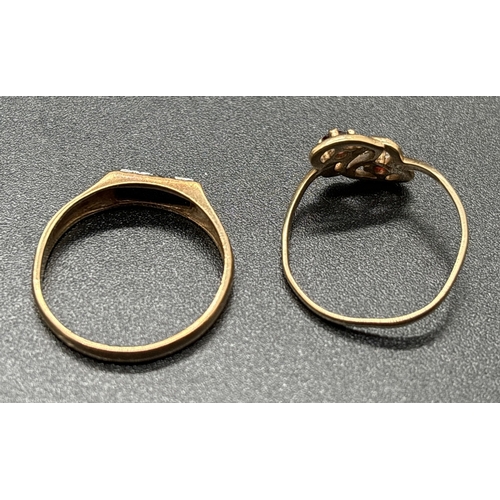 1140 - 2 small 9ct gold rings. A signet ring set with a rectangle of black onyx and a double heart ring set... 