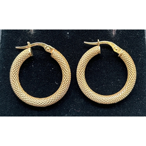 1142 - 3 pairs of 9ct gold earrings. A pair of diamond patterned hoops, a pair of Celtic knot stud earrings... 