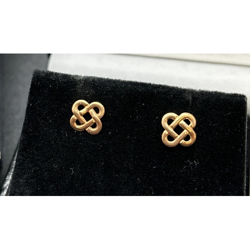 1142 - 3 pairs of 9ct gold earrings. A pair of diamond patterned hoops, a pair of Celtic knot stud earrings... 