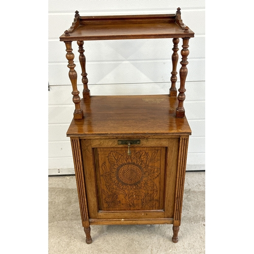 1435 - An Edwardian oak purdonium coal scuttle fireside cabinet with carved floral design to door. Pull-dow... 