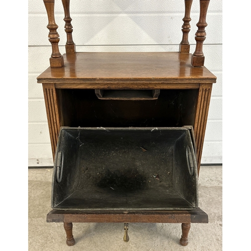 1435 - An Edwardian oak purdonium coal scuttle fireside cabinet with carved floral design to door. Pull-dow... 