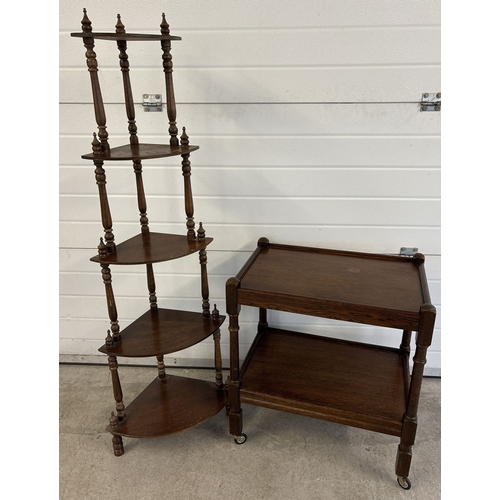 1436 - 2 items of dark wood mid century furniture. A 2 tier tea trolley on wheels together with a 5 tier co... 